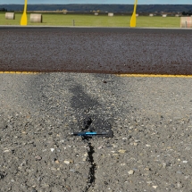 Spray Patch is placed prior to micro-surfacing to mitigate reflective cracking